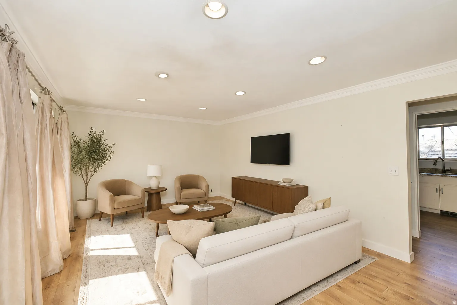 Side A living room, wood floors recessed lighting.