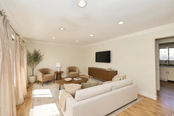 Side A living room, wood floors recessed lighting.