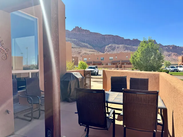 Private outdoor patio with a stucco privacy wall