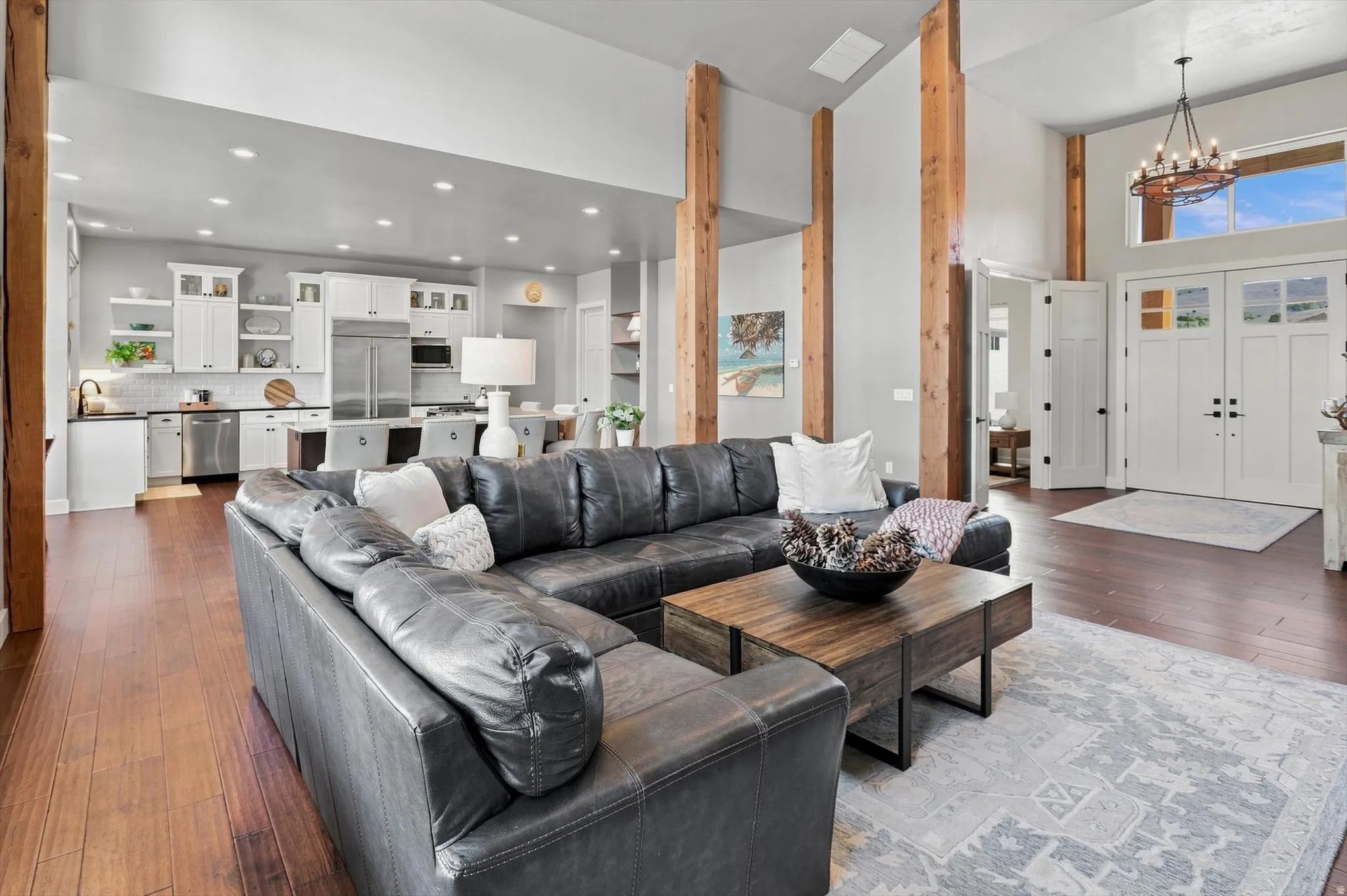 Open concept living space with wood-finish flooring