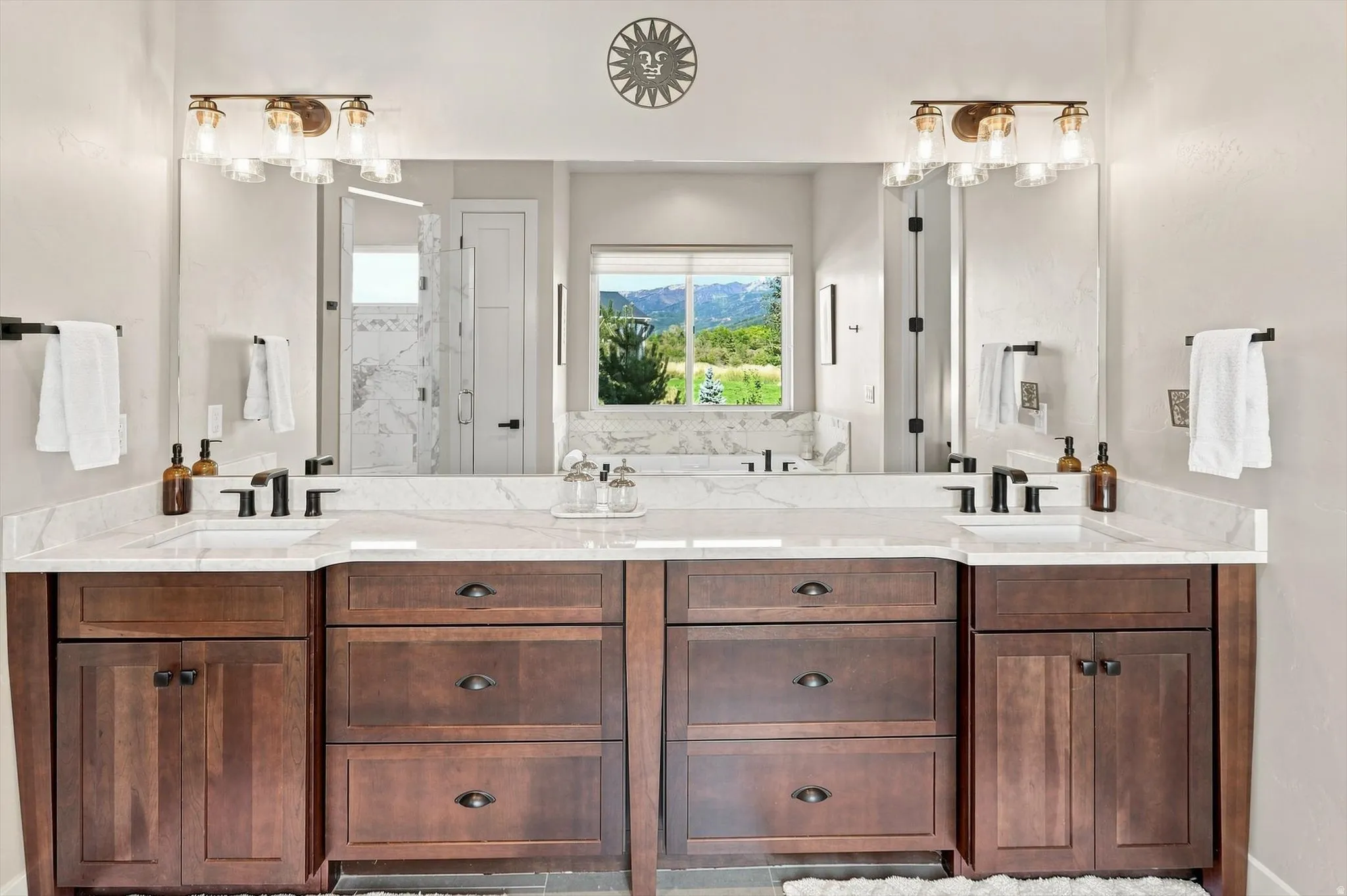 Dual vanity with white countertops and undermount sinks