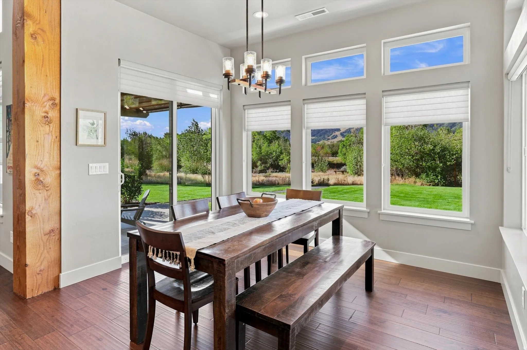 Wood-finish flooring with abundant natural light from multiple windows