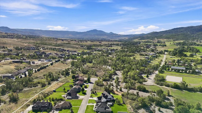 Expansive valley setting with distant mountains and varied terrain