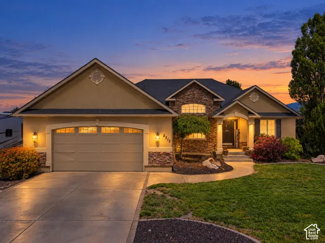Stucco and stone exterior with architectural shingles