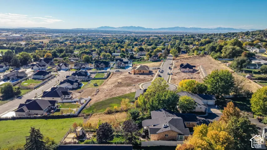 Expansive residential development with established homes, new construction, and undeveloped lots
