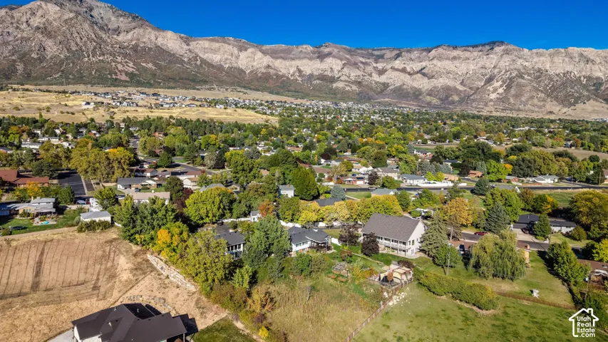 Expansive mountain backdrop with a residential neighborhood
