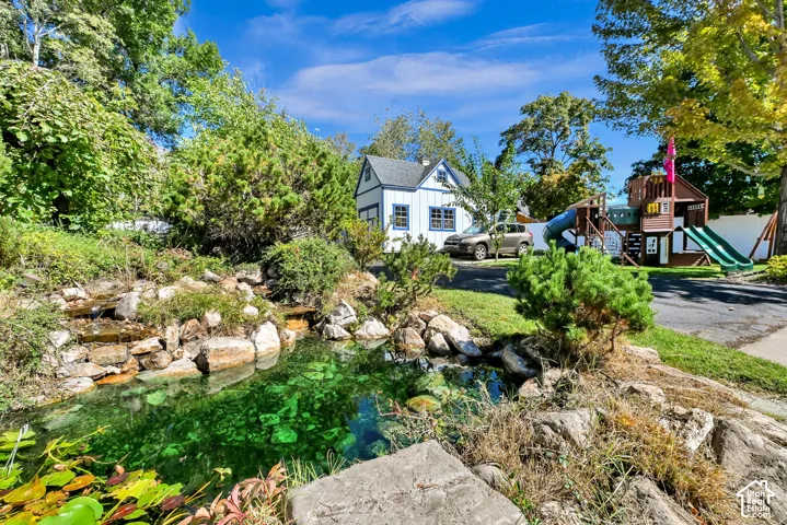 Landscaped water feature with natural rock elements