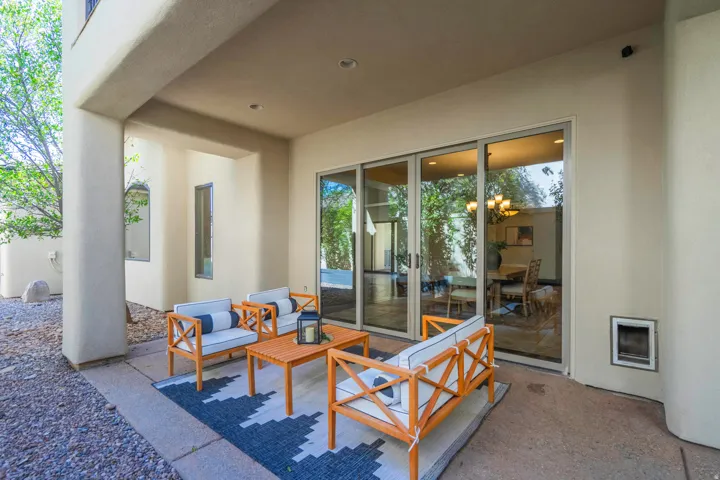 Covered patio with concrete flooring, recessed lighting, and sliding glass doors