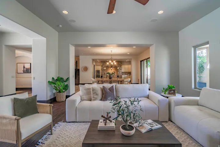 Recessed lighting, wood-finish flooring, and a ceiling fan