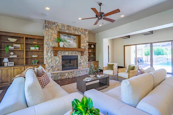 Stone-clad fireplace with a wood-beam mantel