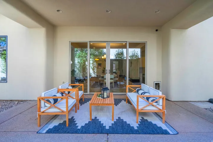 Covered patio featuring a concrete floor, recessed lighting, and a sliding glass door
