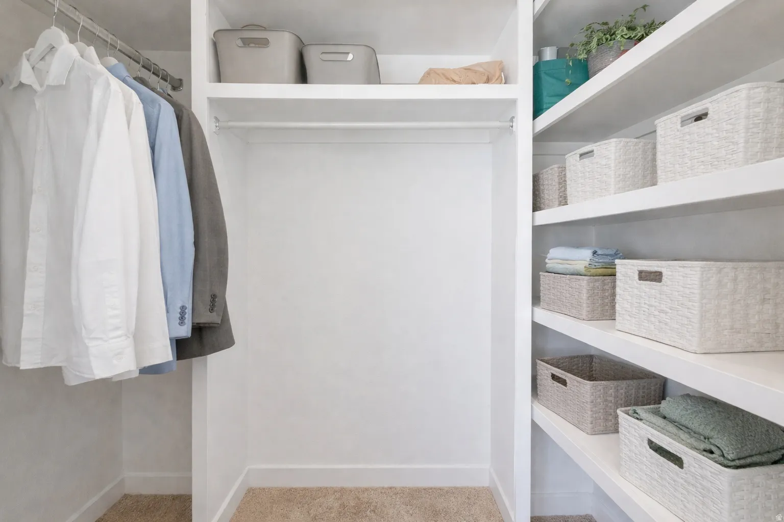 Built-in closet system featuring multiple hanging rods and extensive shelving