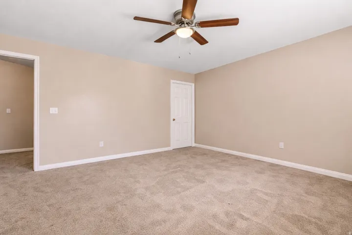 Carpeted flooring, recessed lighting, and a ceiling fan with integrated illumination
