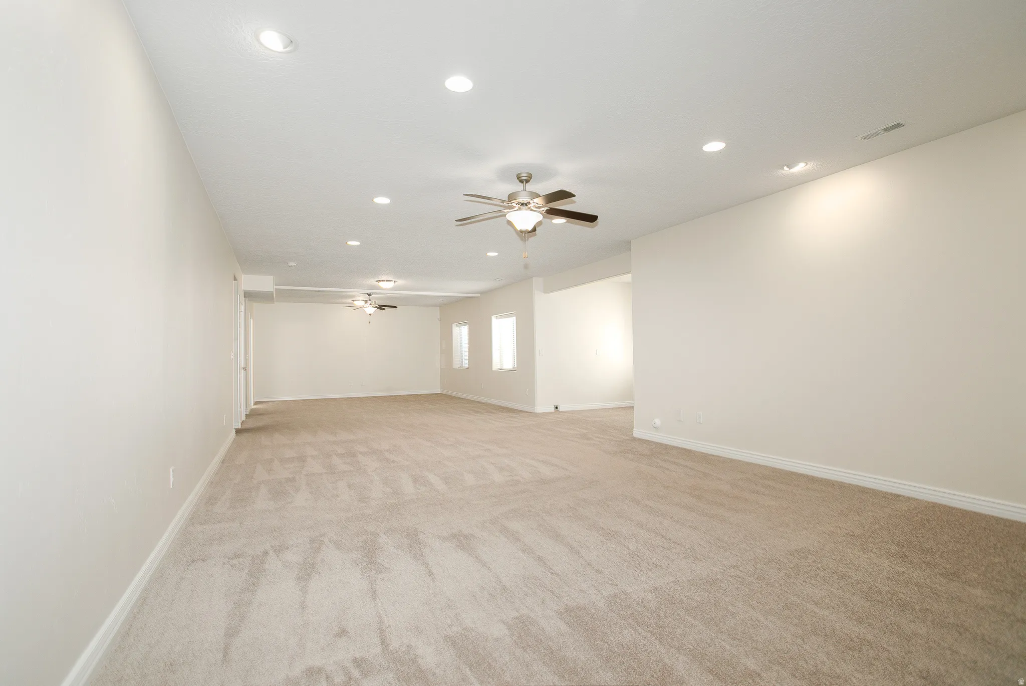 You could have a four-lane bowling alley in this wide-open basement. (Don't quote me on that, I have no idea the regulation size of bowling alleys, though it looks the part)