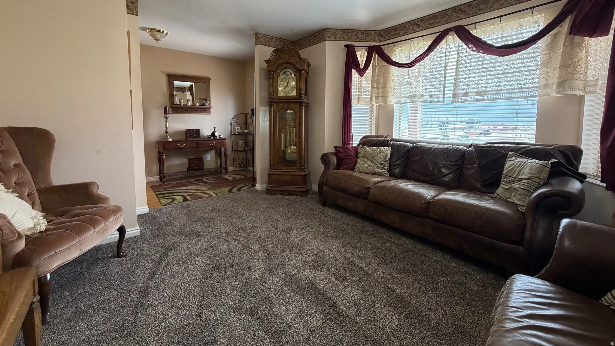 Plush carpet flooring complements neutral wall tones