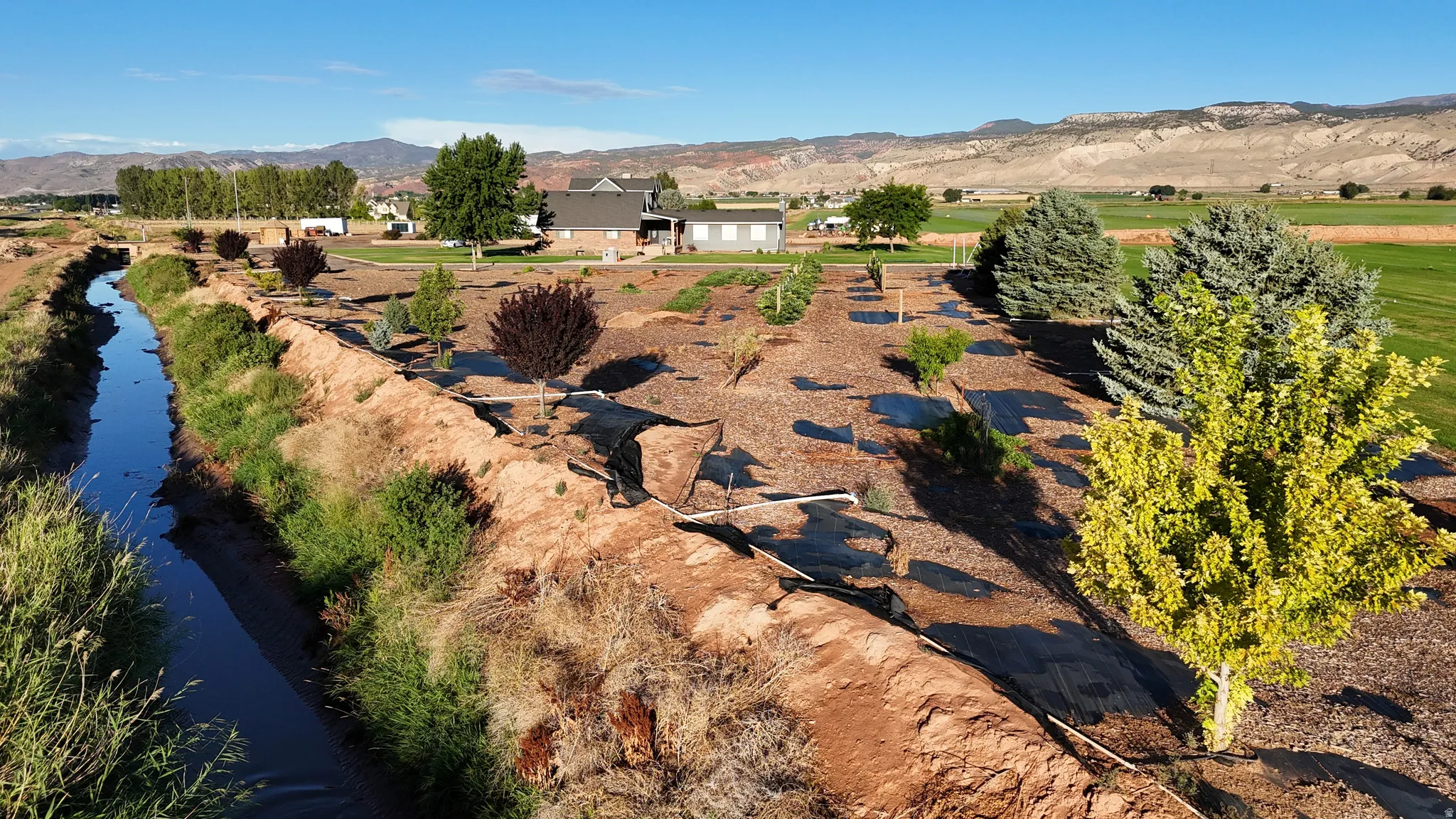 Waterway bordering the property with established landscaping