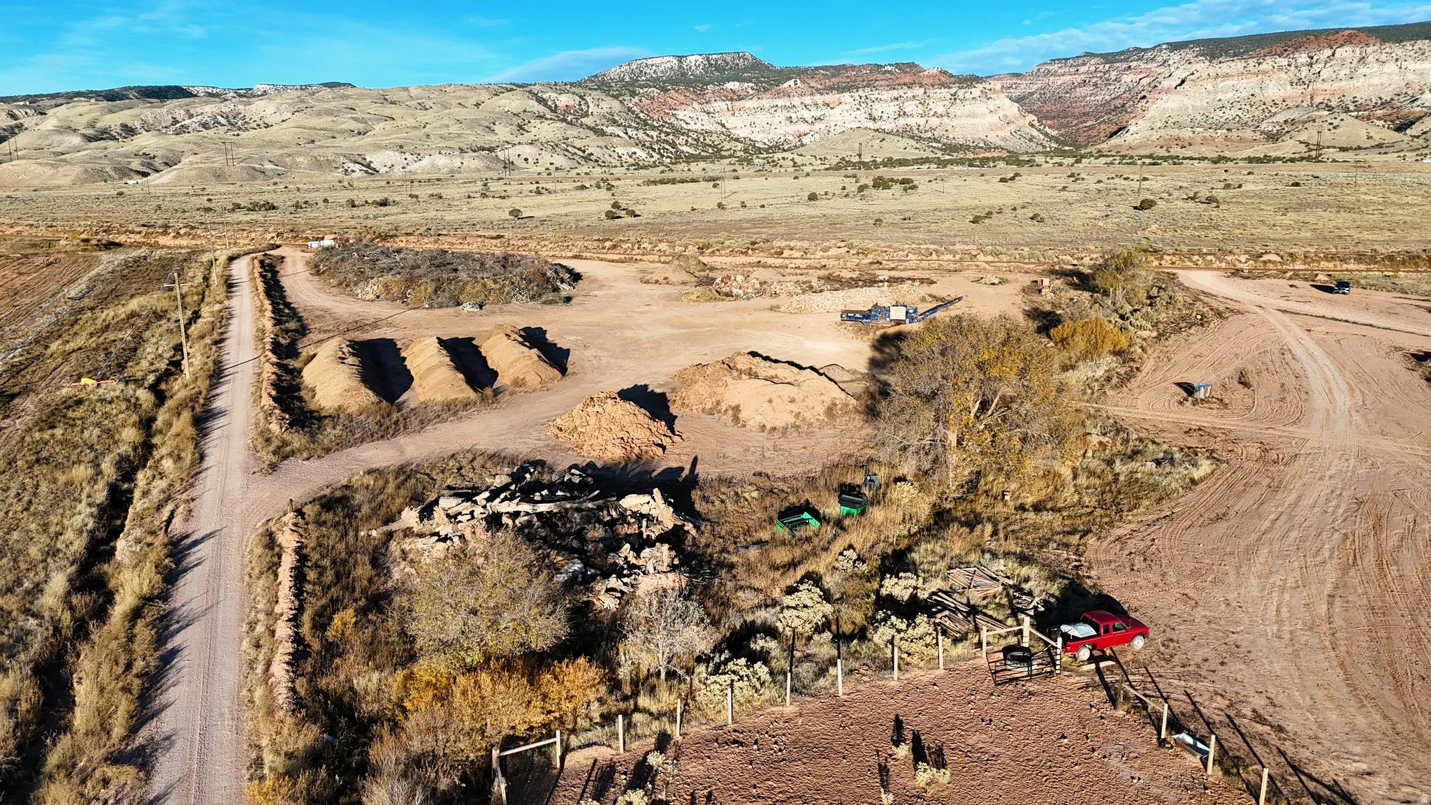 Expansive open terrain featuring a natural landscape and distant mountain formations