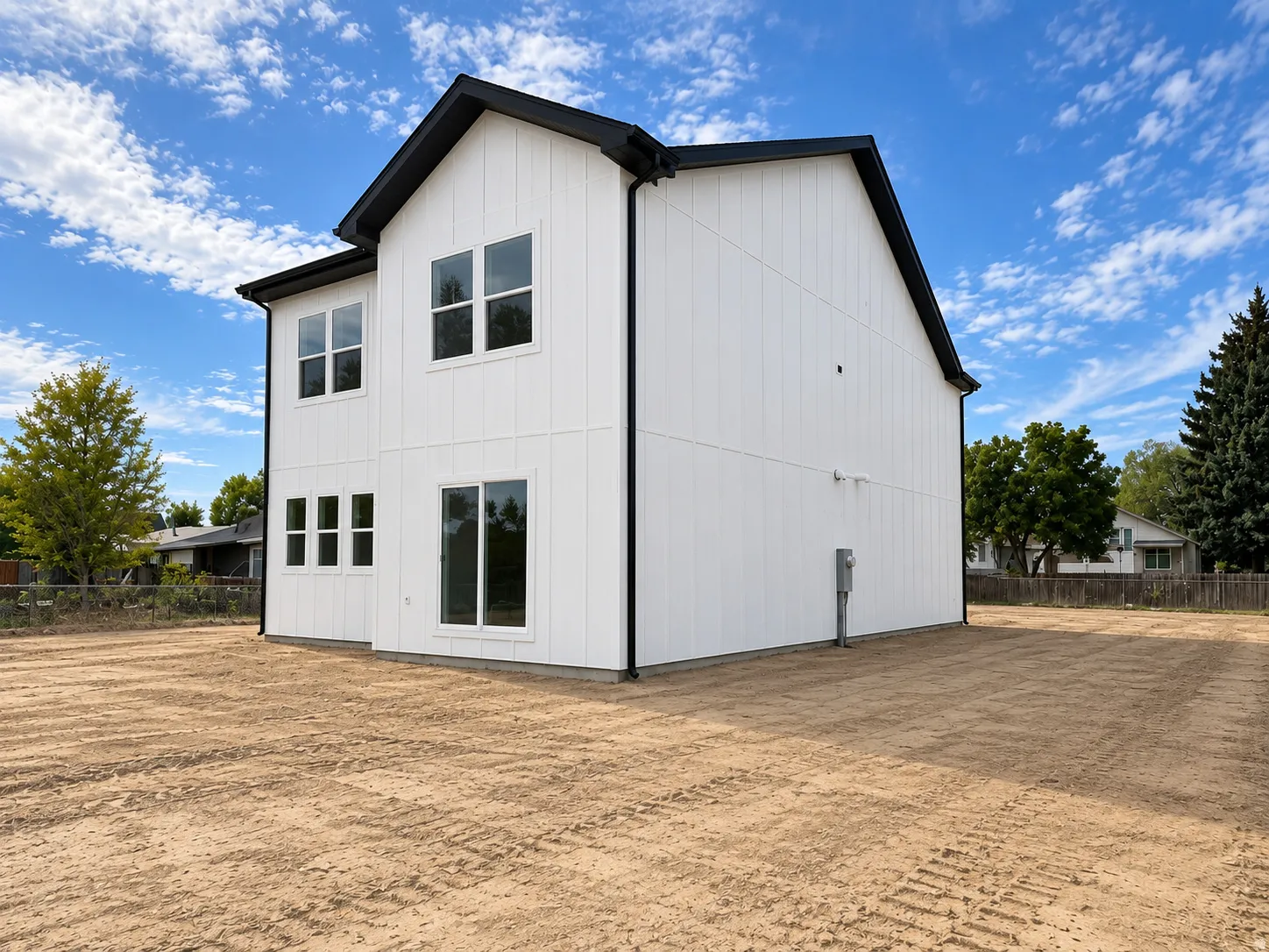 Two-story exterior with white vertical siding and black trim.