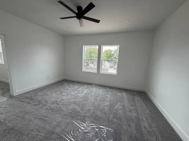 Master Bedroom - Recessed lighting, contemporary ceiling fan, dual windows, and plush grey carpeting