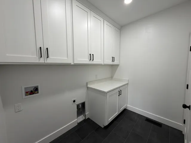 White shaker cabinetry with matte black hardware