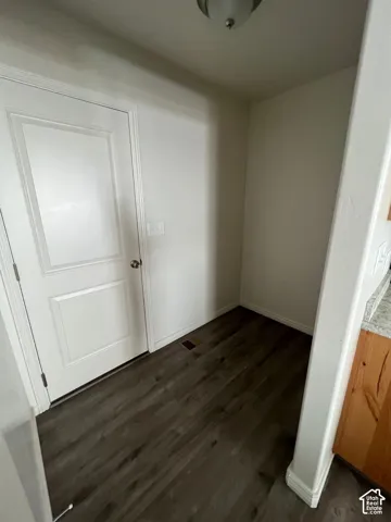 Wood-finish flooring with crisp white walls and ceiling