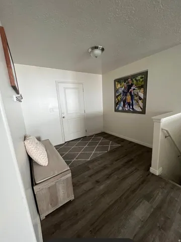 Wood-finish flooring throughout the entry
