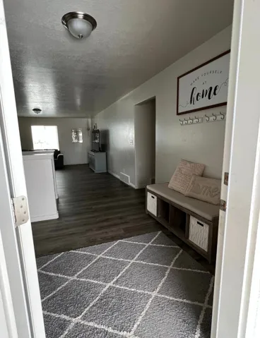 Wood-finish flooring throughout the space