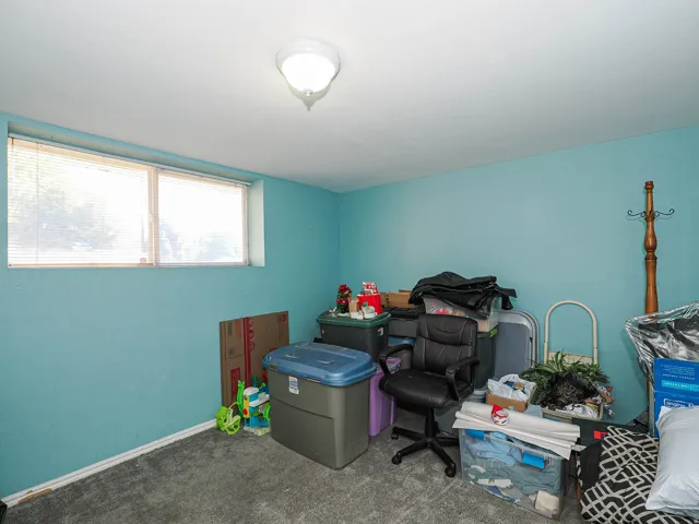 Recessed window, ceiling-mounted light fixture, and blue painted walls