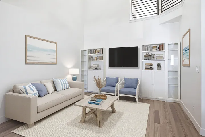 Vaulted ceilings, wood-finish flooring, white built-in shelving, and a prominent wall-mounted media area