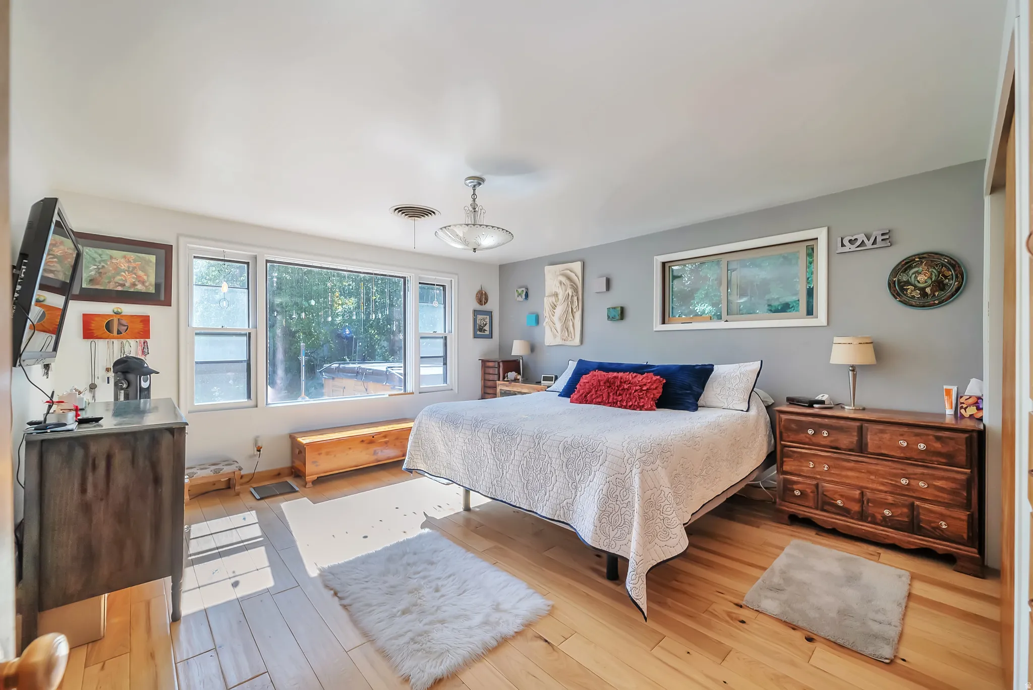 Wood-finish flooring throughout, complemented by a light-colored wall finish