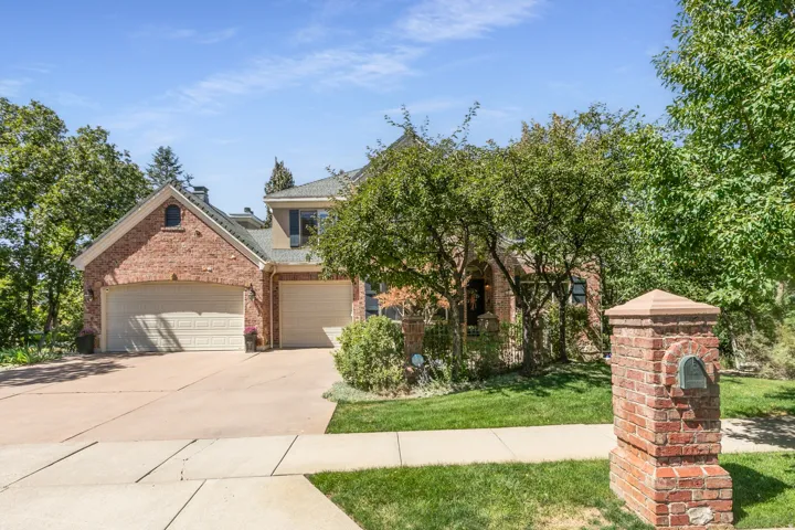 Brick-clad exterior with multiple gables and a two-car garage