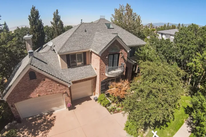 Brick exterior with a shingled roof