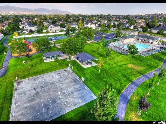 Community amenities featuring a swimming pool, multiple covered pavilions, a basketball court, tennis courts, and a playground