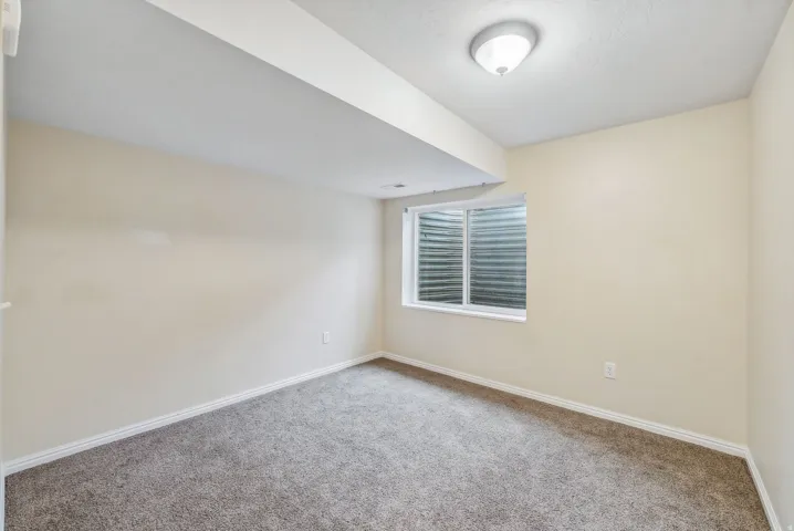 Neutral toned walls and carpeting, offering a clean, ready-to-personalize interior