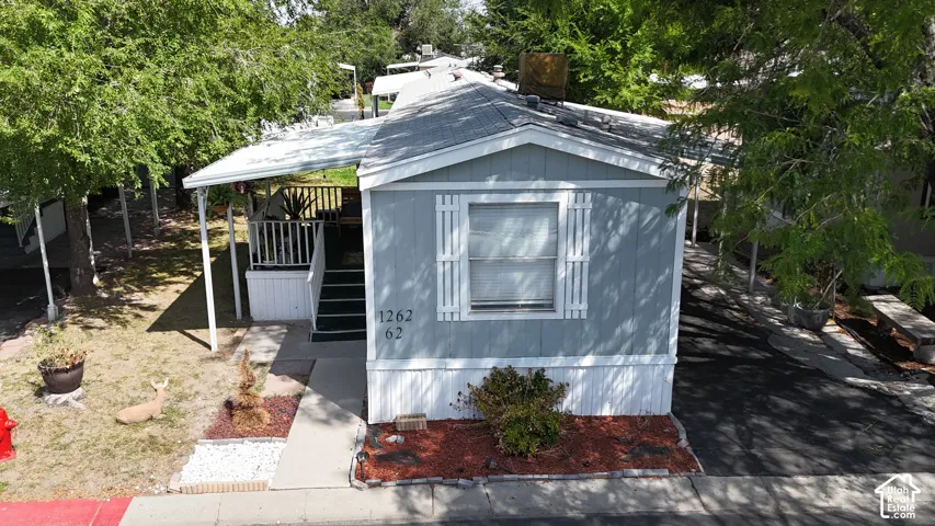 Light blue siding with white trim and decorative shutters