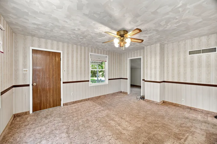 Patterned wall covering with wainscoting and coordinating trim