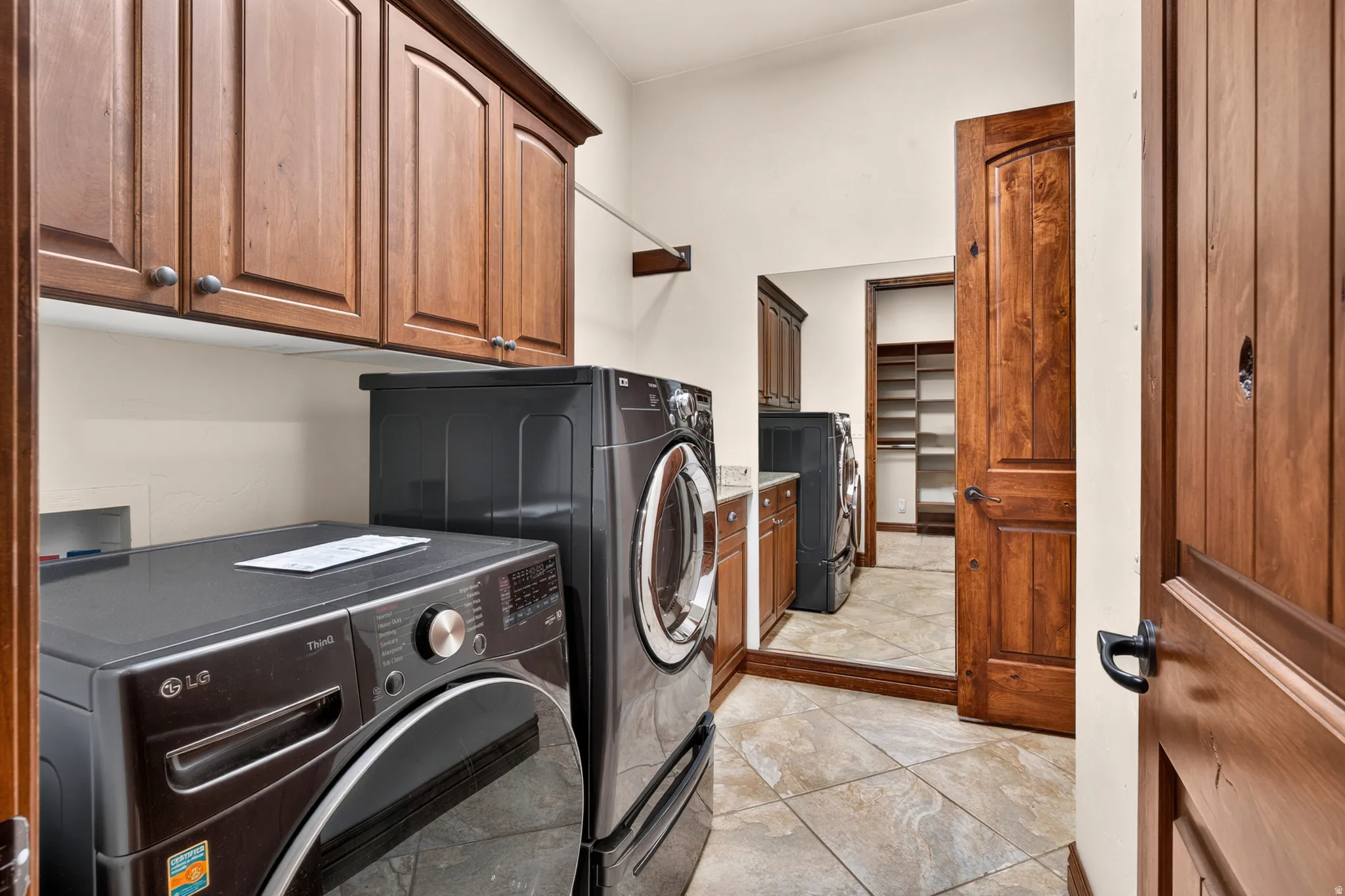 Laundry area conveniently located by the garage