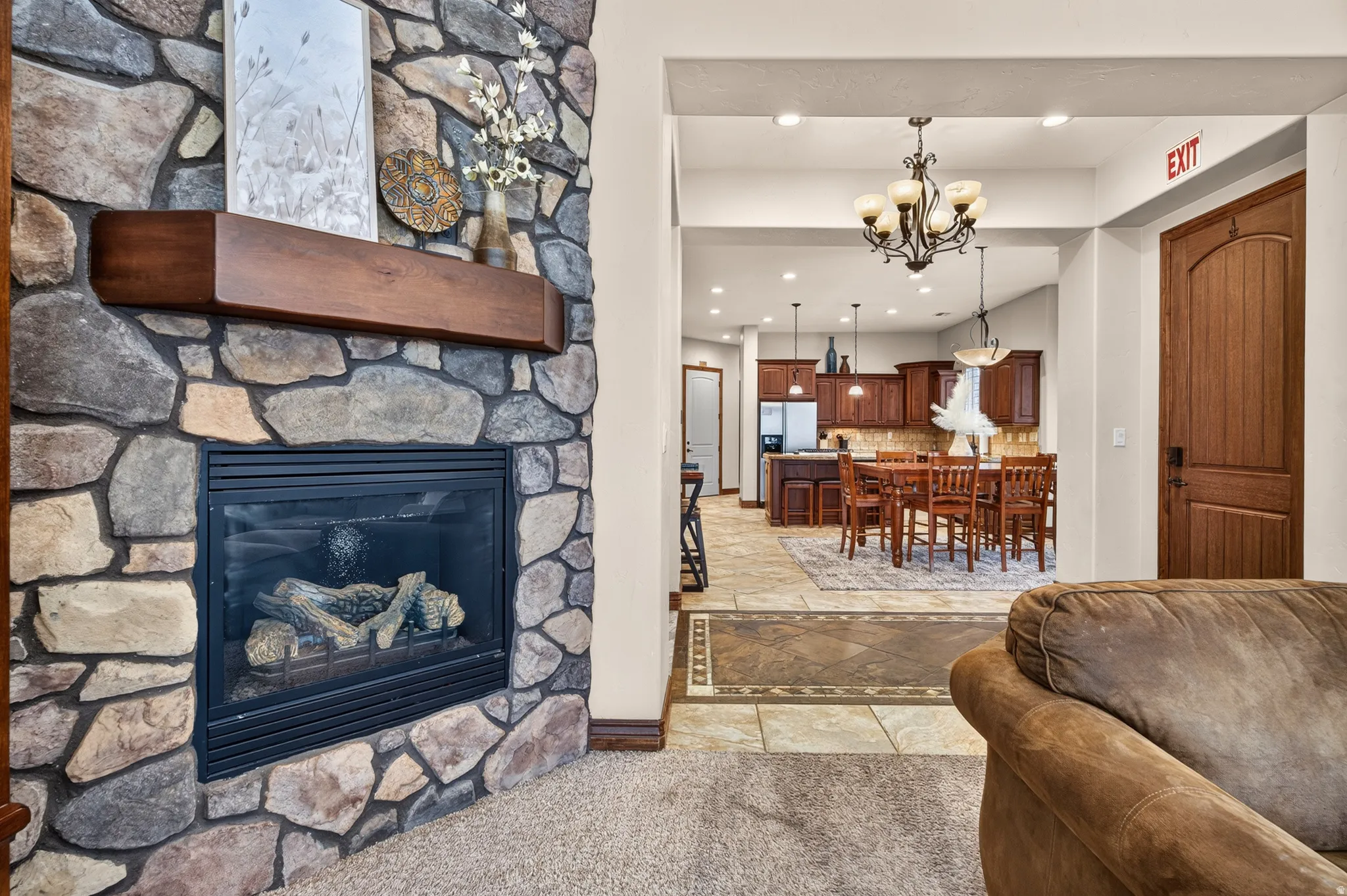 Stone-finish fireplace with a wood mantel