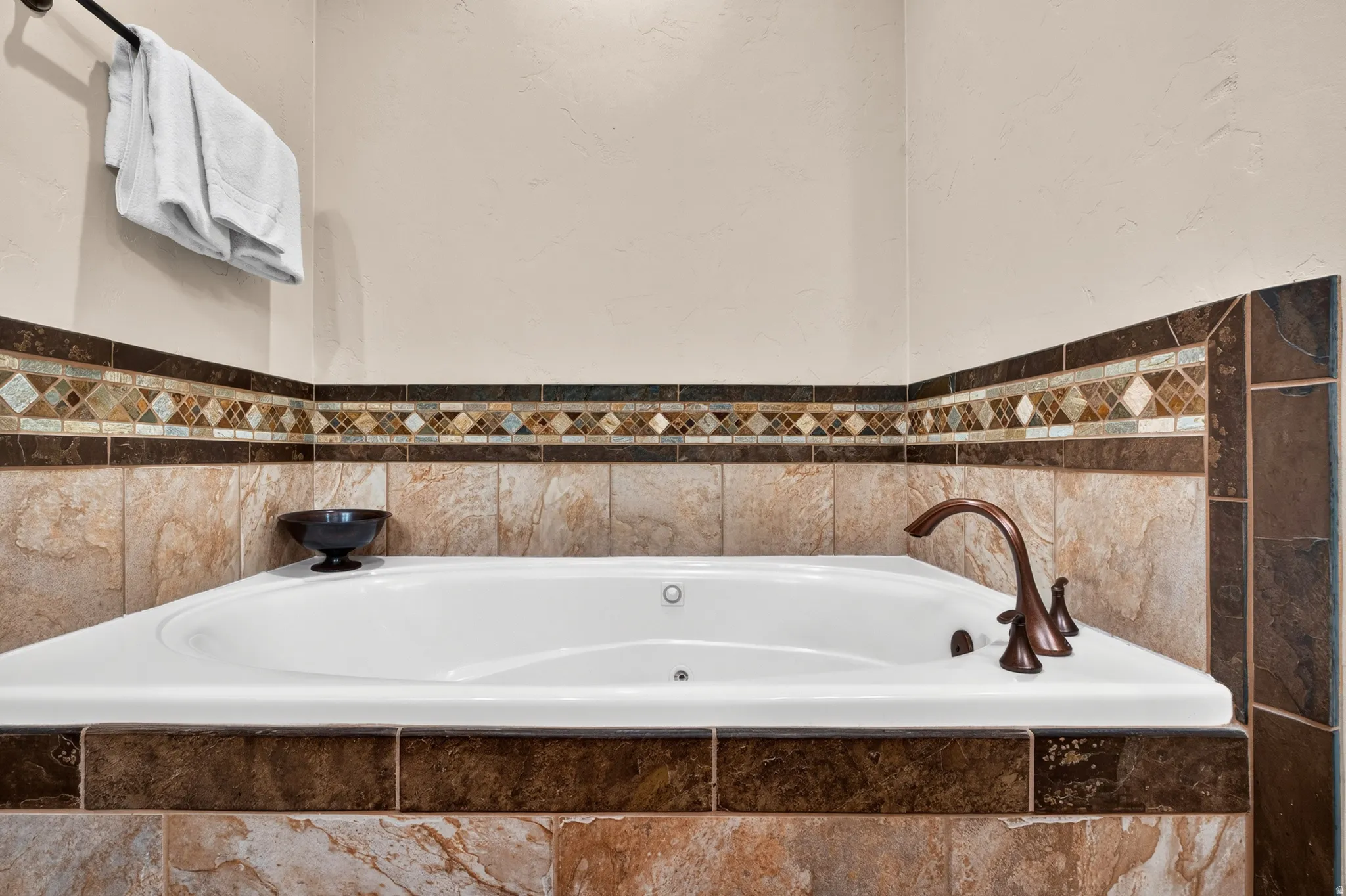 Beautiful soaking tub and mosaic accent tile