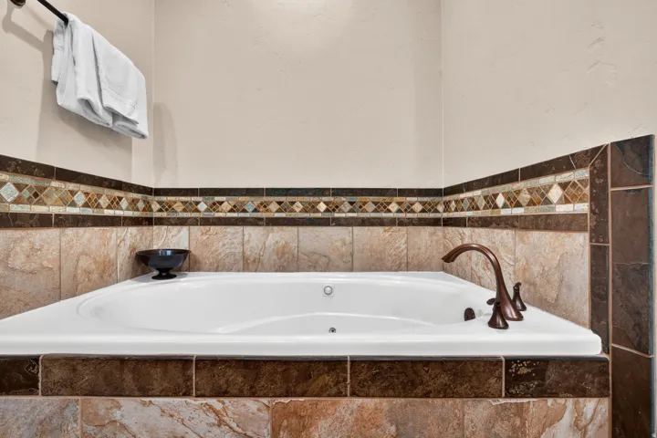 Beautiful soaking tub and mosaic accent tile