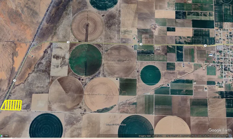 Satellite Imagery. Showing the property highlighted in yellow, surrounded by agricultural fields and infrastructure