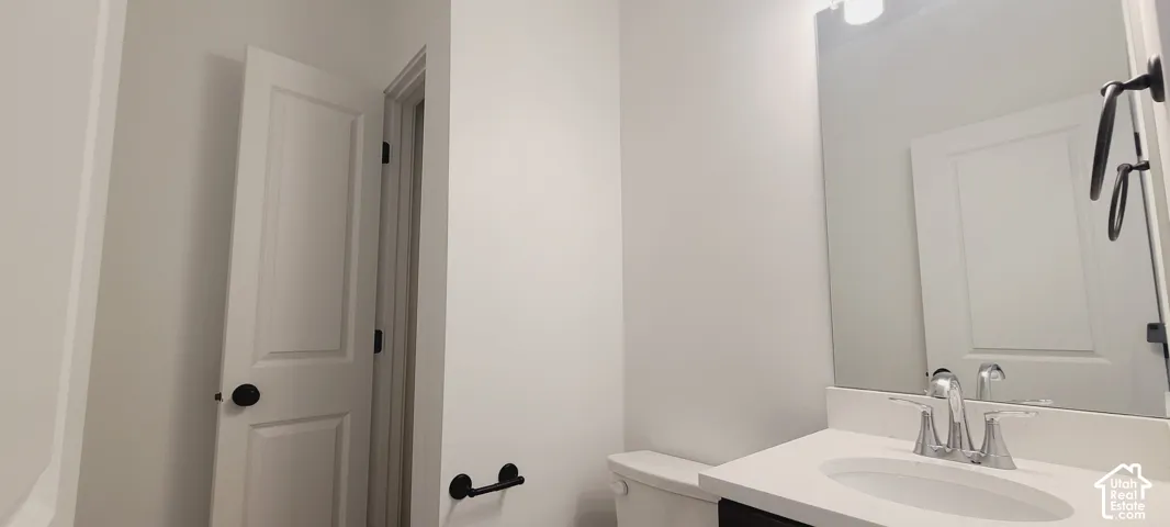 White vanity with an integrated sink and chrome faucet
