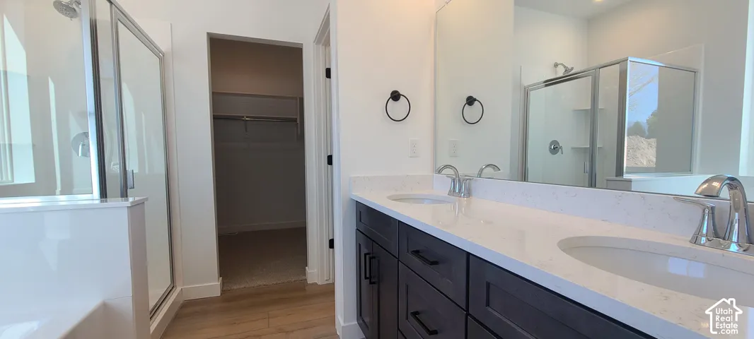 Double vanity with dark wood-finish cabinetry and white countertops