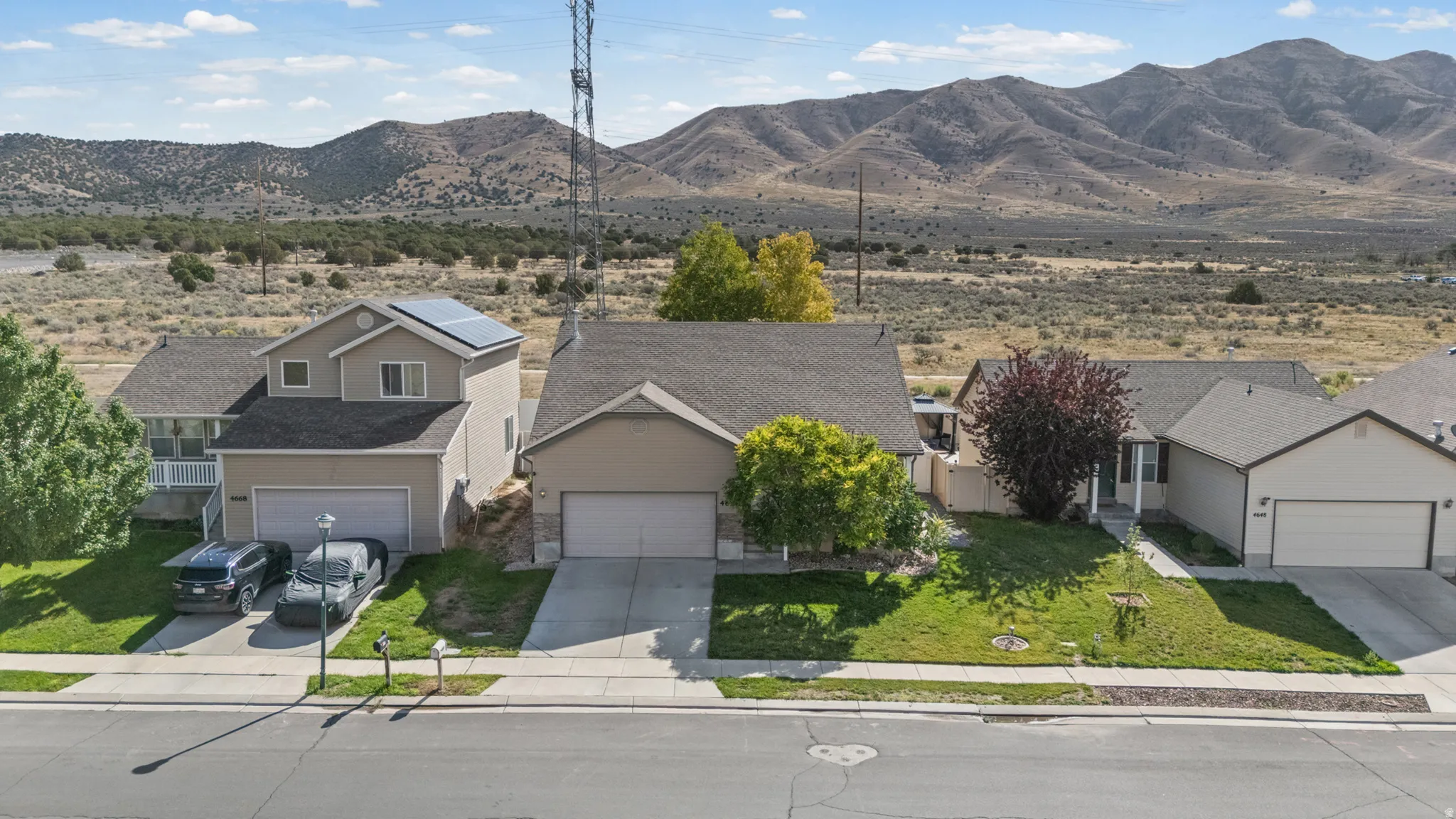 Single-story residence with a two-car garage, concrete driveway, and front yard landscaping