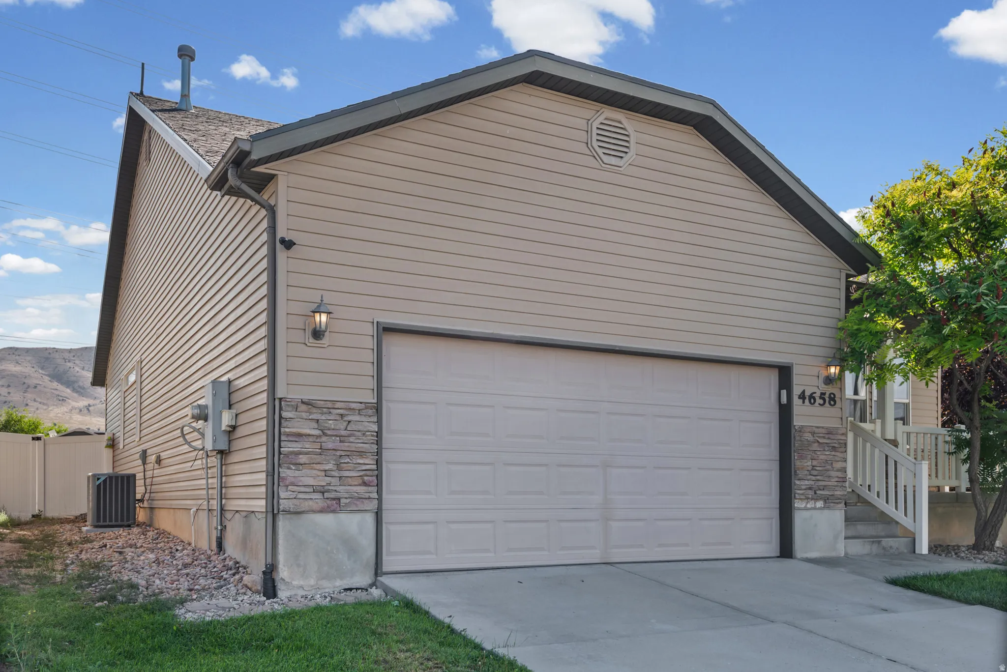 Attached two-car garage with a panel door