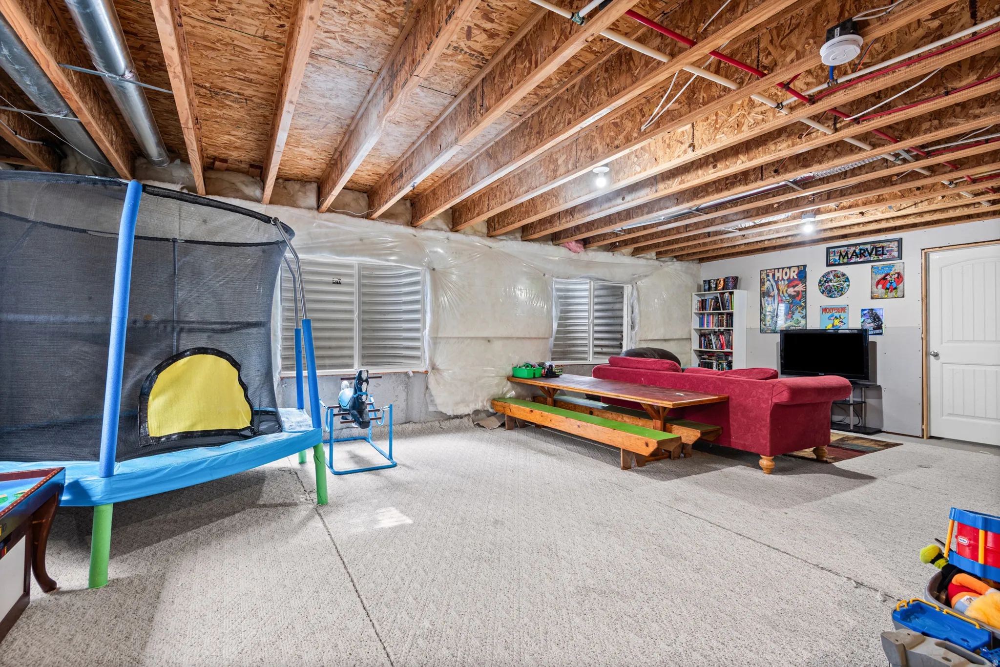 Exposed wood beam ceiling with recessed lighting