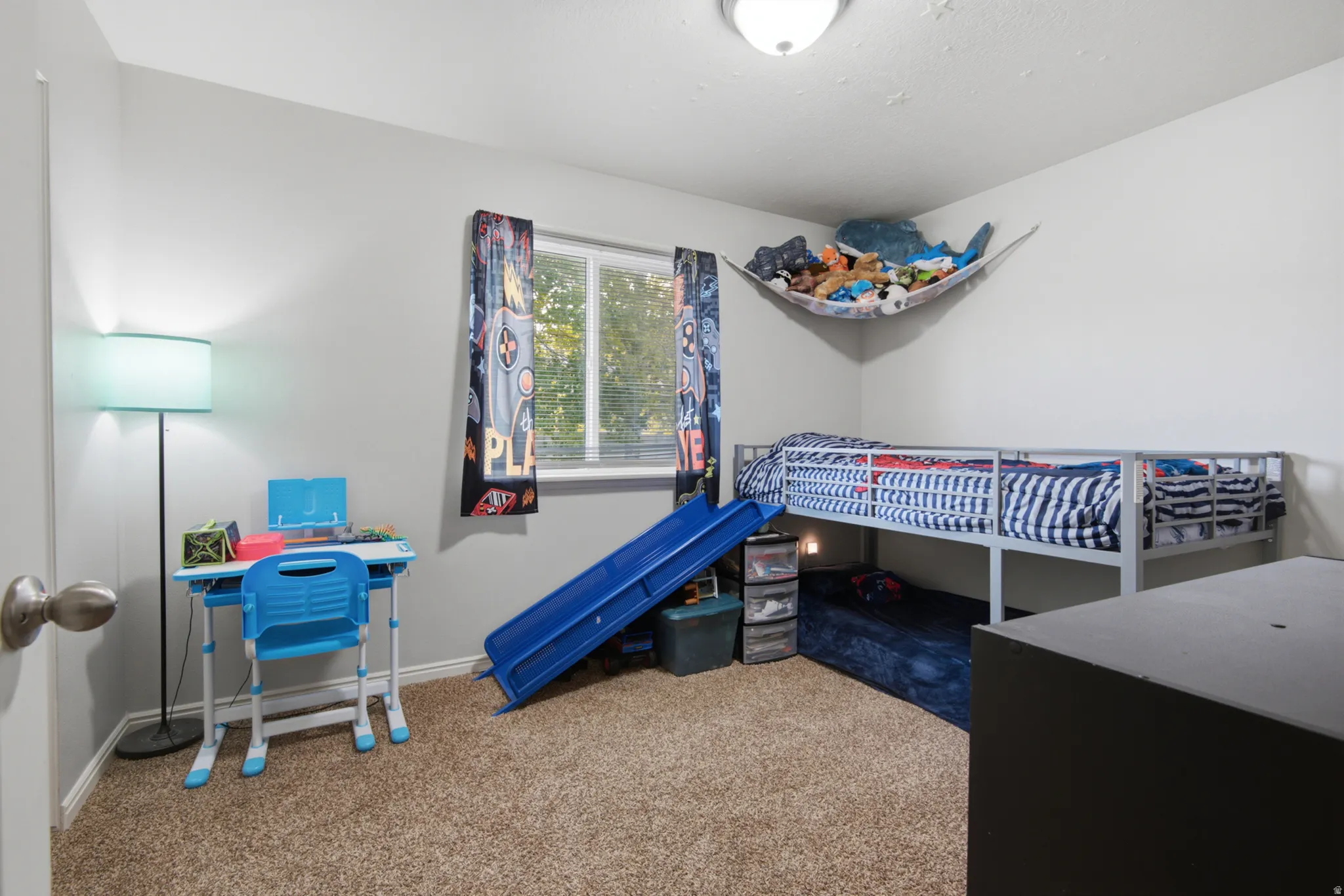 Wall-to-wall carpeting and white walls