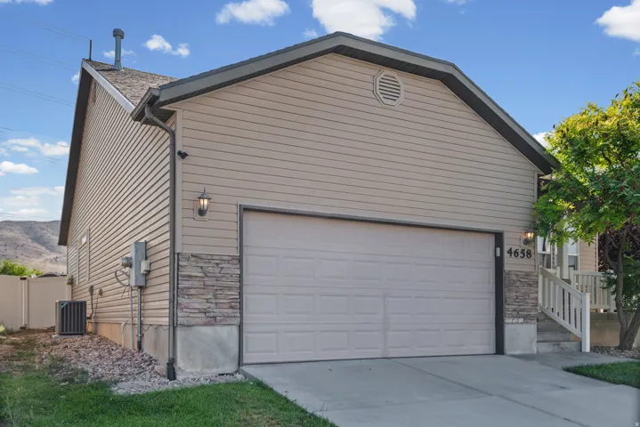 Attached two-car garage with a panel door
