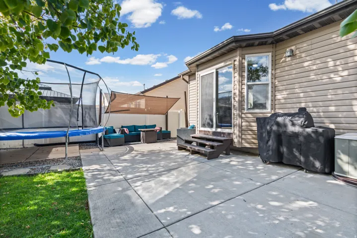 Concrete patio with direct access to interior via sliding glass door