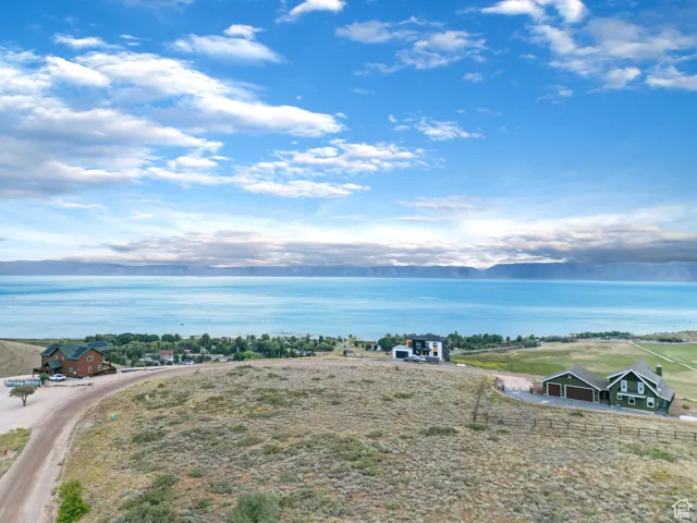 Expansive water frontage with mountain backdrop